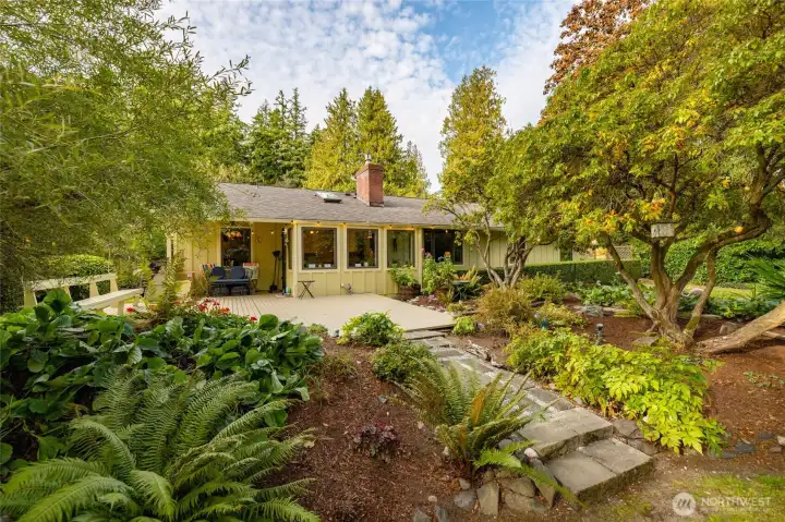 Your own personal garden paradise right outside your door.  This spacious, ground-level deck offers the perfect stage for al fresco dining, entertaining, or just watching the seasons come and go.