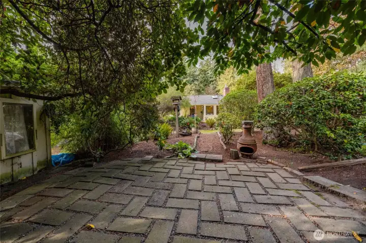 The "secret patio," where nature creates a quiet sanctuary for reflection or small gatherings.