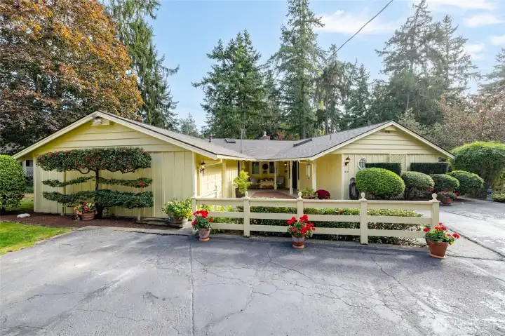 The front of the home showing a sample of the mature, meticulously cared for landscaping.