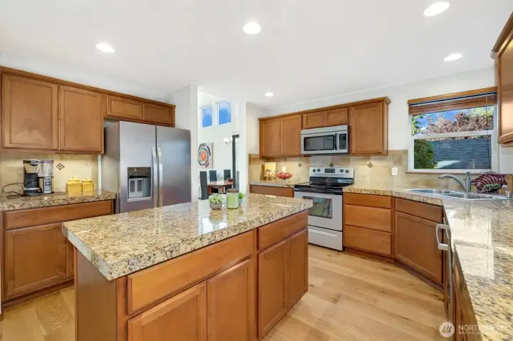 A true chef’s kitchen with high-end SS appliances, abundant storage, and thoughtful details throughout