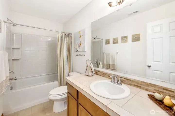Beautiful full bath offering comfort and accessibility for guests or main-floor living