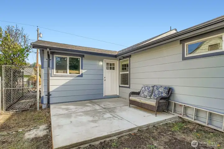 Large patio off the back of the home. Perfect size for a BBQ and table to make dinner and enjoy your own space.