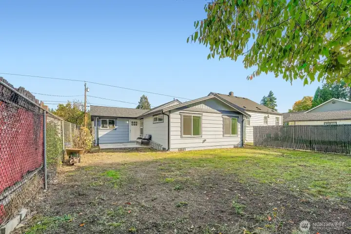 View from shed in the backyard. As you can see, this landscape is waiting for your ideas! Add a garden, a playset, a trampoline or pool - the options are endless.