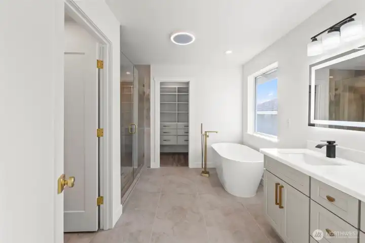 Primary bath with soaking tub and dual vanity