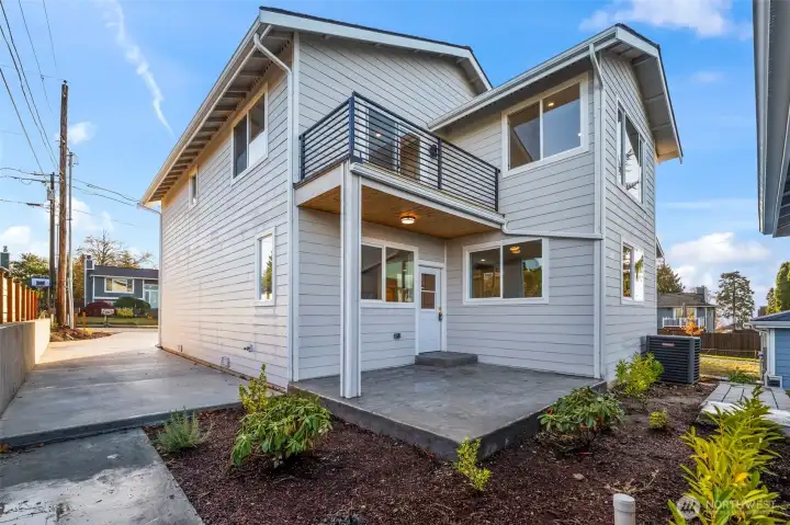 Back of home with patio