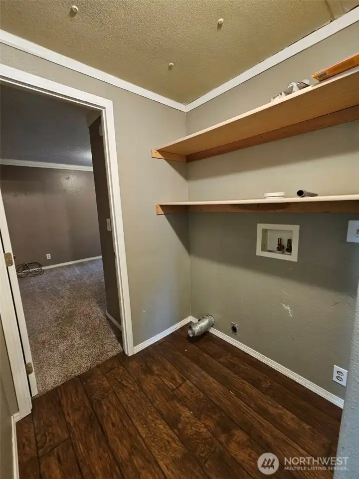 Landry room with additional storage.