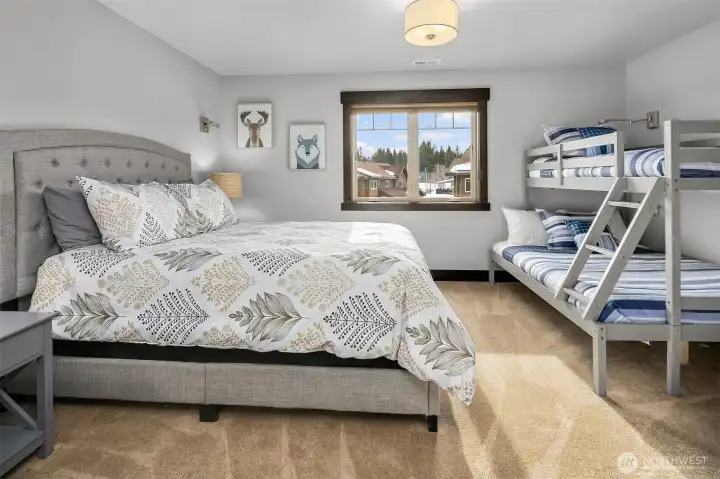 4th bedroom bathroom with tile floors, granite counters double sinks