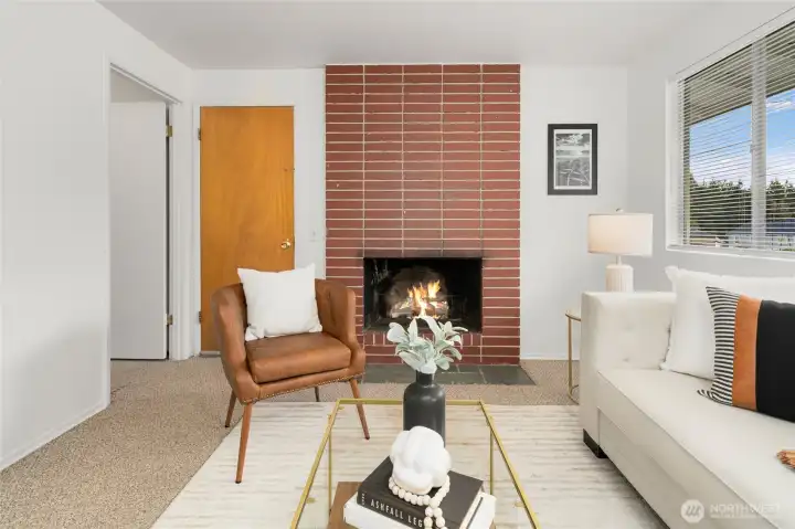 Original brick fireplace in living room.