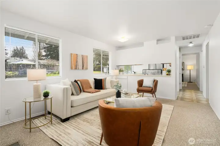 Living room opens to kitchen. Dining room down the hallway. All bedrooms are on the backyard side!