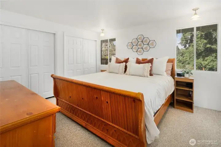 King-sized Owner Suite with 2 closets and door to full bathroom.