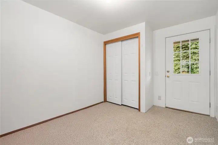Bedroom #3 with door to backyard.