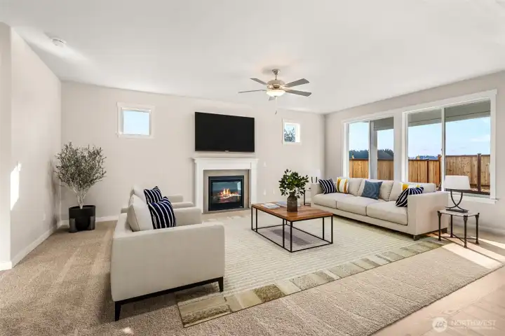 Grand living room anchored with a gas fireplace.