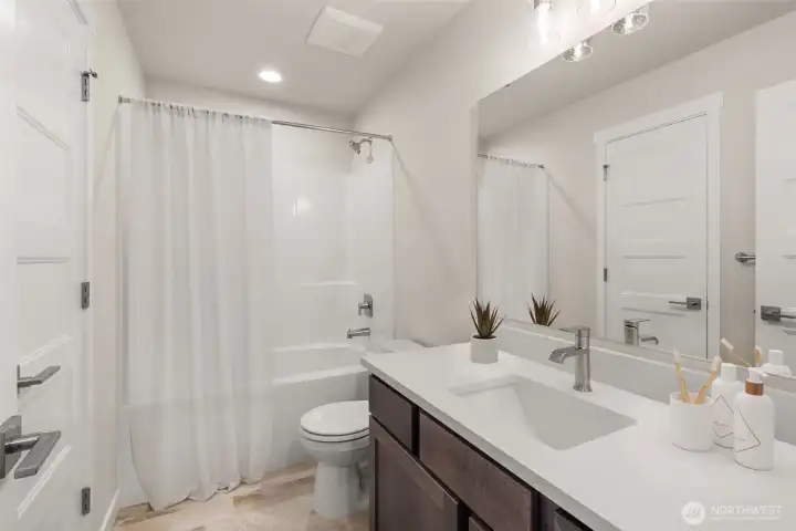 Upstairs full bath with quartz.
