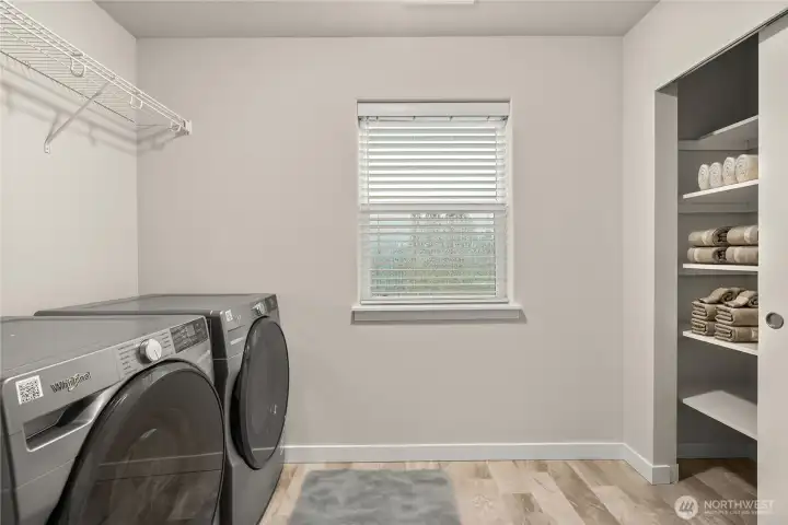 Utility room with ample closet space.