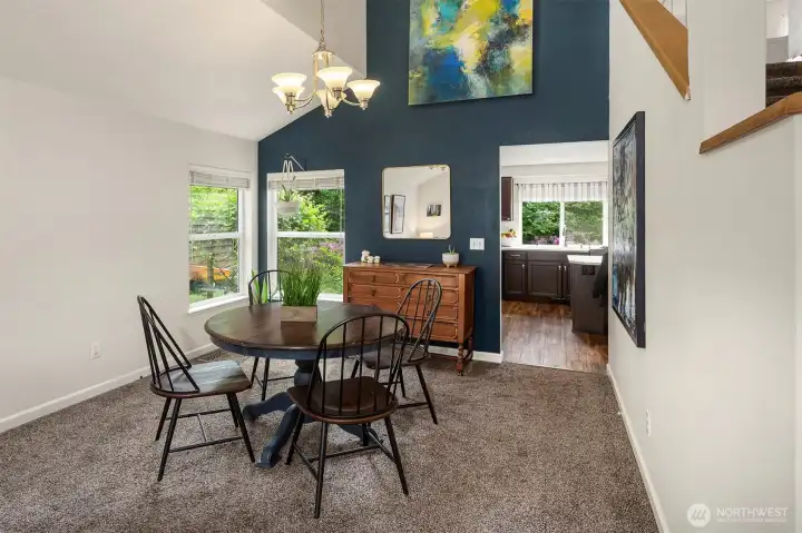 Dining room with soaring ceilings.
