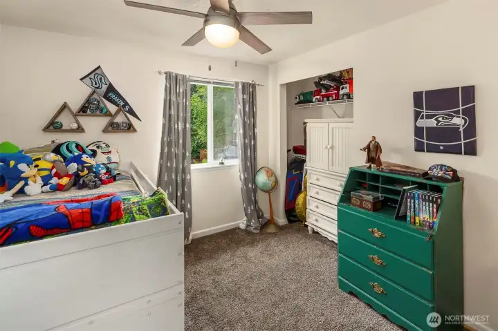Third bedroom with views to backyard.