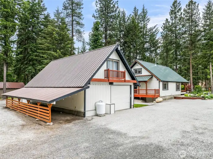 Garage with 'snowmobile barn' lean to
