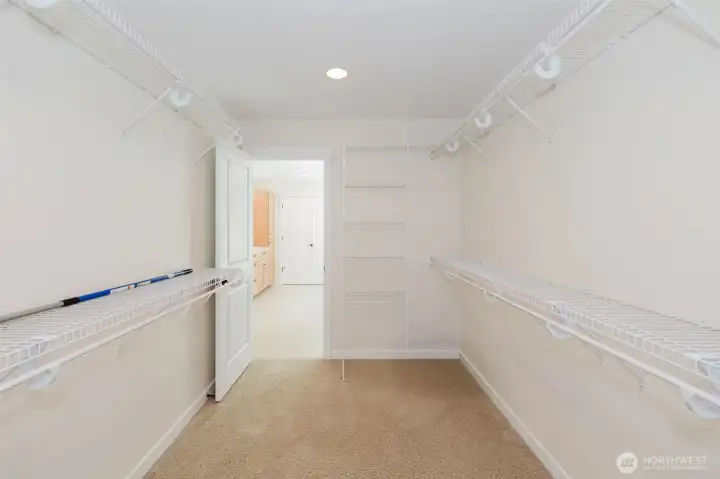 Primary walk-in closet Primary walk-in closet