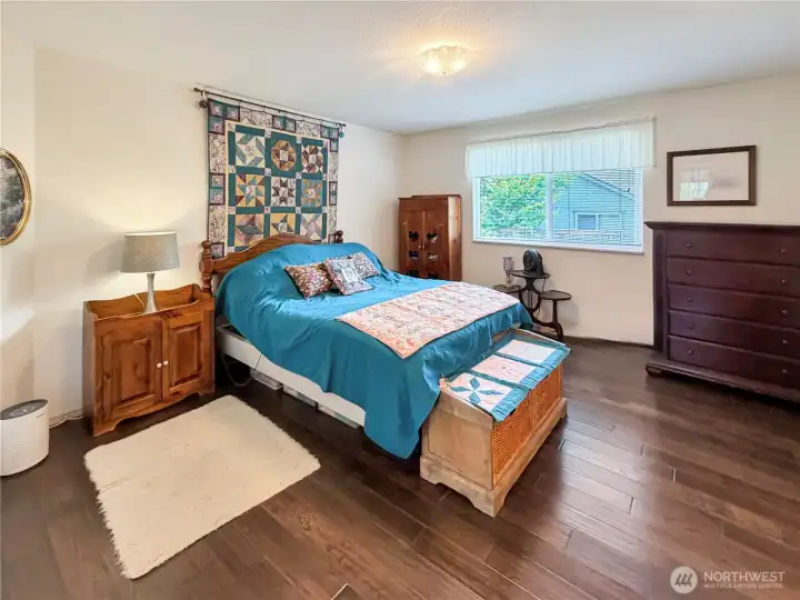 Large primary with gorgeous hardwood floors.