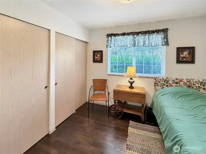 Another view of bedroom 2 shows large closets.
