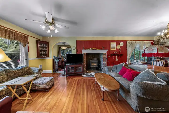 Area off living room, separated by an arch, has door to outside. Great place for an office or small library and reading room.