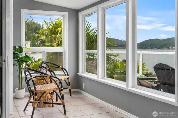Grab a Book or a Cup of Coffee and Enjoy this Bright Sunroom for Year-Round Lake Views