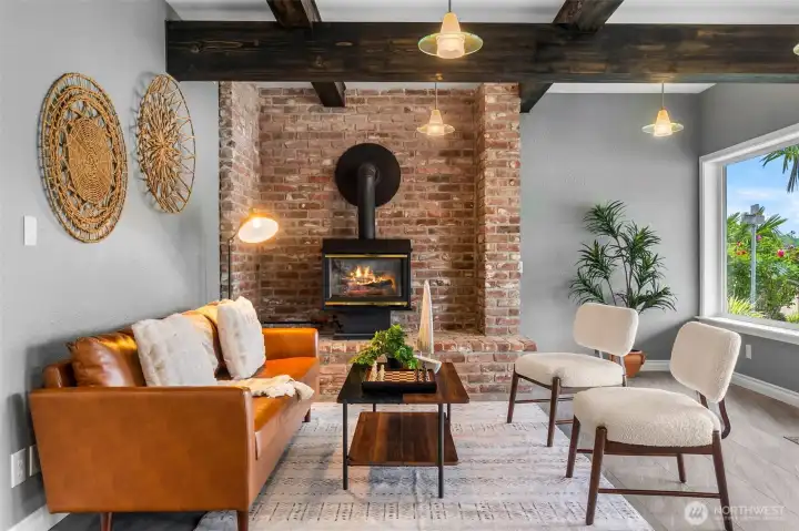 Recently Serviced Gas Fireplace with Beautiful Brick Warms the Space Making it Cozy Year Round!