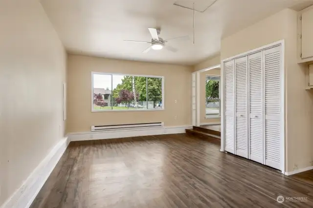 The large picture window in the family room overlooks the front yard, and the large family room has your storage needs covered with two closets including this one with louvered doors.
