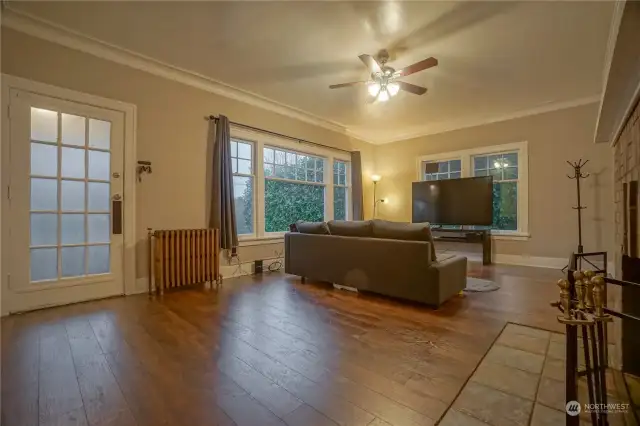 Middle - large and bright living room with dining area.