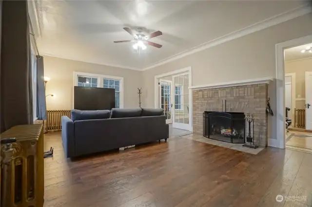 Middle - another view of living room with fireplace.