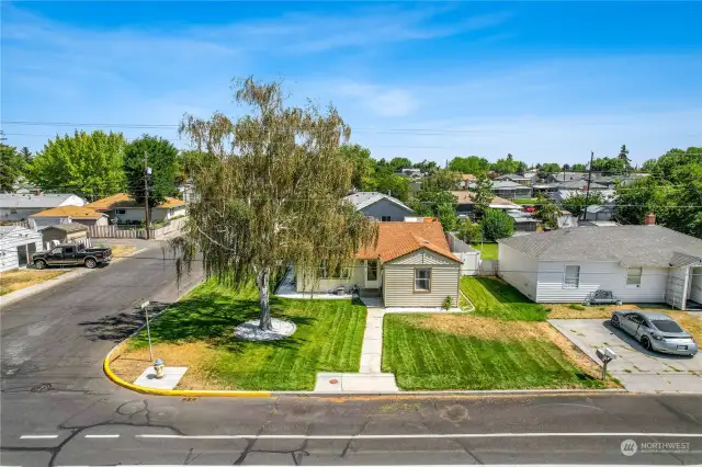 Sitting back on a large corner lot with a fenced-in backyard, you're close to shopping, medical facilities, and schools.