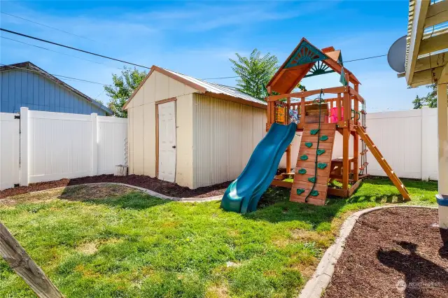 Included with the property is this fine shed and a bit of easy-maintenance landscaping! (Playset not included.)