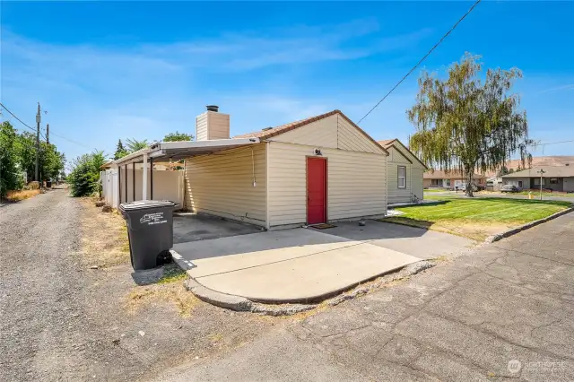 Park in the carport or on the driveway or slab in front of the beautiful red back door.  Enclose the carport for storage and even more privacy.  The alley is handy for getting to the large back gate in the fence.