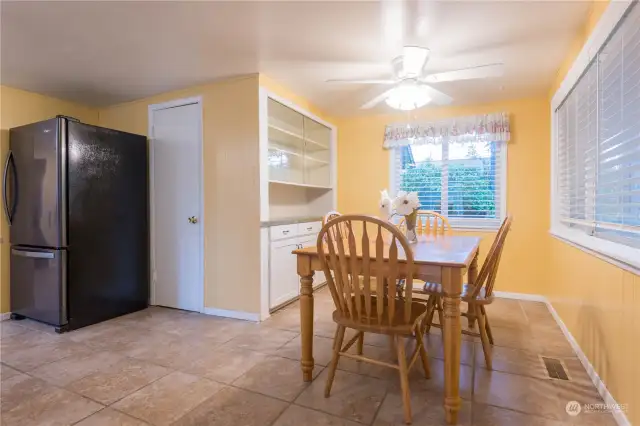Dining room has a built in hutch and there is a pantry