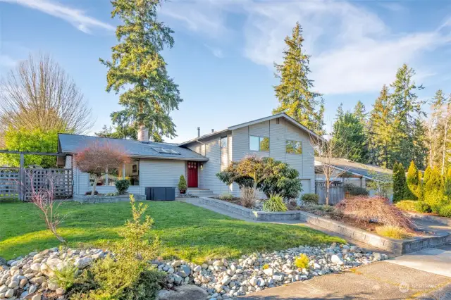 The house sits on a 7,210 sq ft lot, fully fenced, in a tranquil setting.