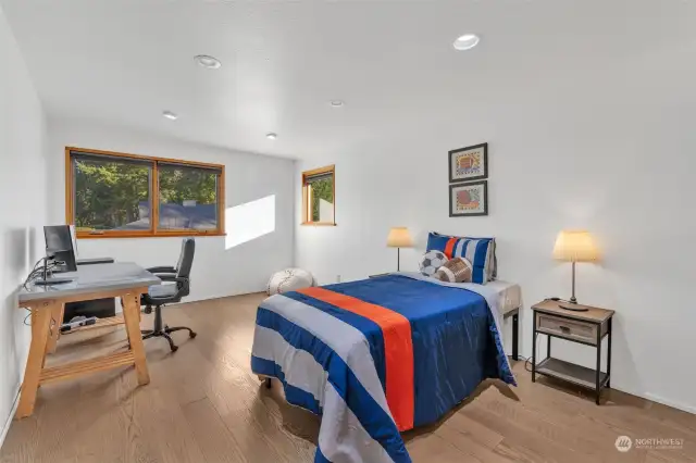 Secondary bedroom on upper floor, hardwood floor (and closet on the right, not pictured).