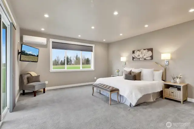 This spacious primary ensuite offers plenty of room for both maximum comfort and peaceful relaxation. A designated mini split was added in addition to the HVAC system for specific cooling/heating zone control.