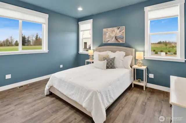 Bedroom #2 with its multiple windows creates a bright and airy feeling yet allows for extreme relaxation with the color pallete chosen.