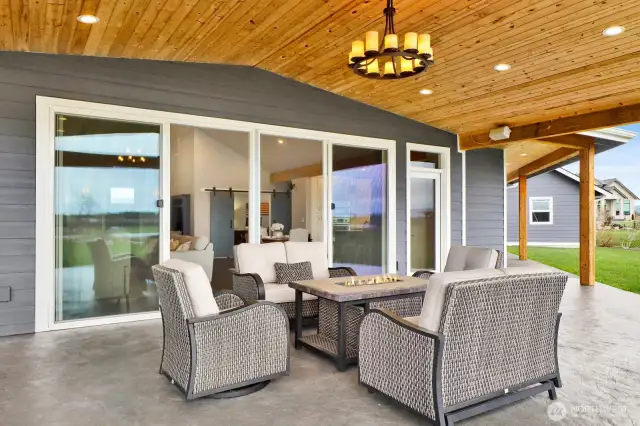 This close-up view of the patio nicely highlights the ceiling and chandelier that really add to the elegance of this outdoor living space.