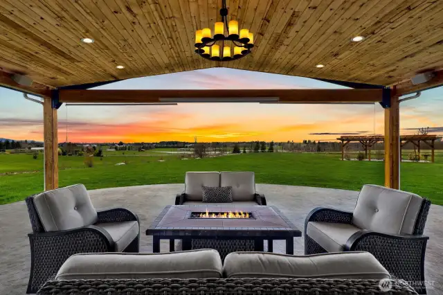 Breathtaking views exemplify the evening twilight shows you'd have while relaxing on your patio, complete with outdoor speakers and pull-down shades for the extreme heat....when we have!