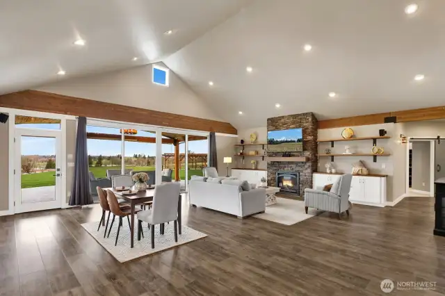 A nice angle of the Living and dining room taken from the office/den/4th bedroom area showcasing how large and open this home lives.