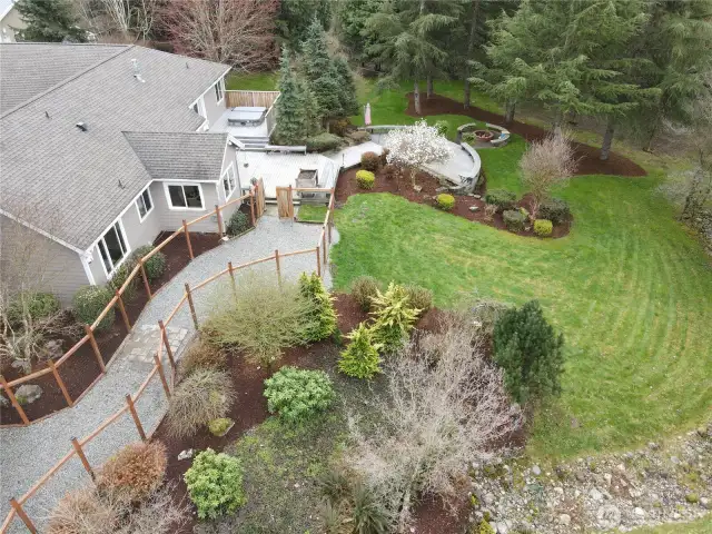 sculptured yard with deck, patio, dog run