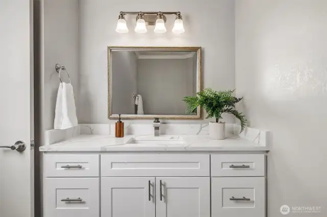 Secondary bathroom with brand new vanity and quartz counter top