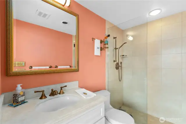 Primary bathroom has been repainted an off white color with brand new ceramile tile.