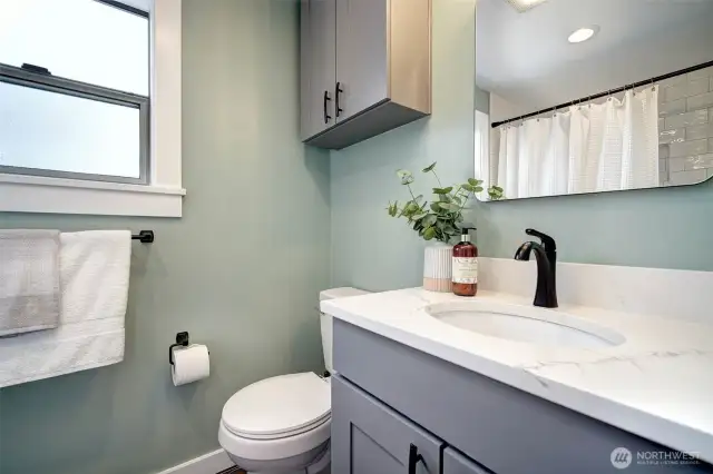 Remodeled bathroom with beautiful tile work and bright colors.