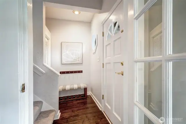 Updated carpet, defined entry nook and coat closet.