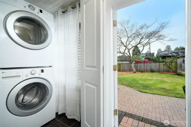 Enclosed utility room off kitchen with additional storage/pantry space.