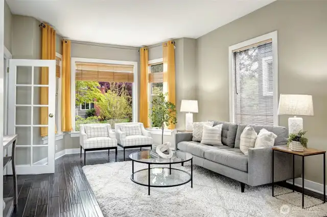 East-facing picture windows, inviting open-concept living and dining room space. Updated interior paint and flooring.