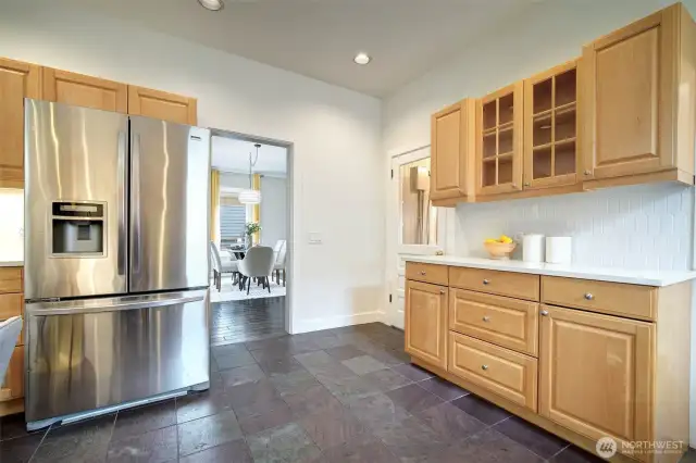 Updated kitchen, supremely functional layout, with plentiful  cupboard storage