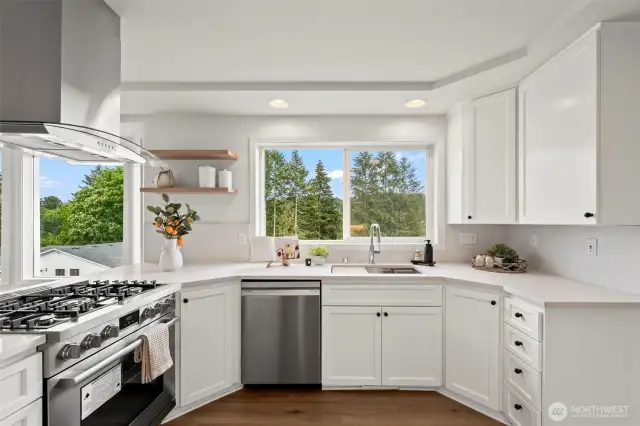 Beautiful white kitchen with quartz countertops , new cabinets and appliances.